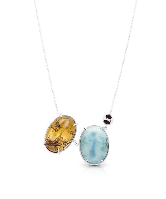 Elegant amber and larimar gemstone pendant necklace with silver chain. Unique jewelry piece for special occasions.
